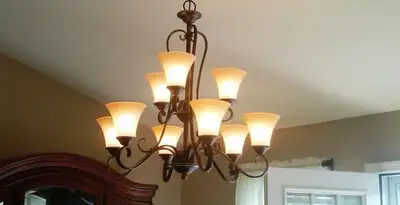 Classic ceiling chandelier installation with warm lighting in San Jose, CA