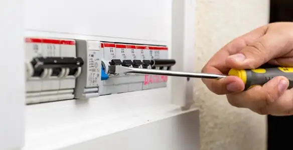 electrical panel upgrade service showing technician adjusting circuit breakers during system upgrade in San Jose, CA