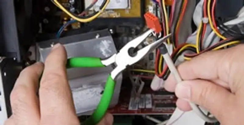 Licensed electrical contractor performing electrical repair with tools in Campbell, CA