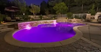 pool light installation and repair services illuminating a residential swimming pool in San Jose, CA