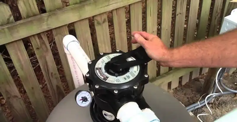 pool pumps service showing professional adjustment of pool pump control system in San Jose, CA